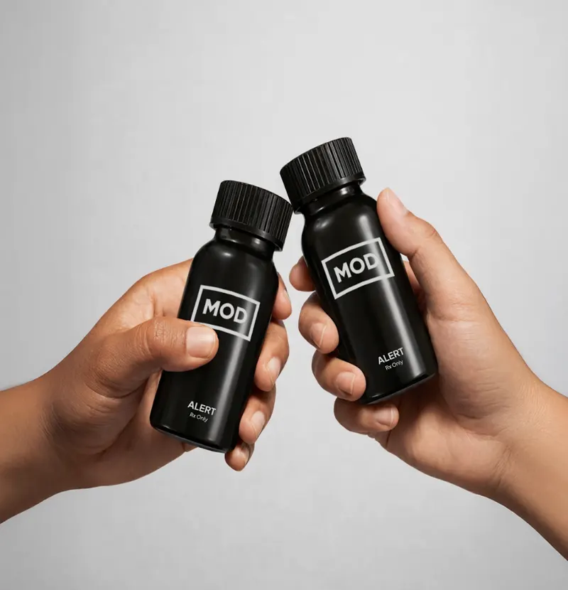Two hands touching MOD alert bottles