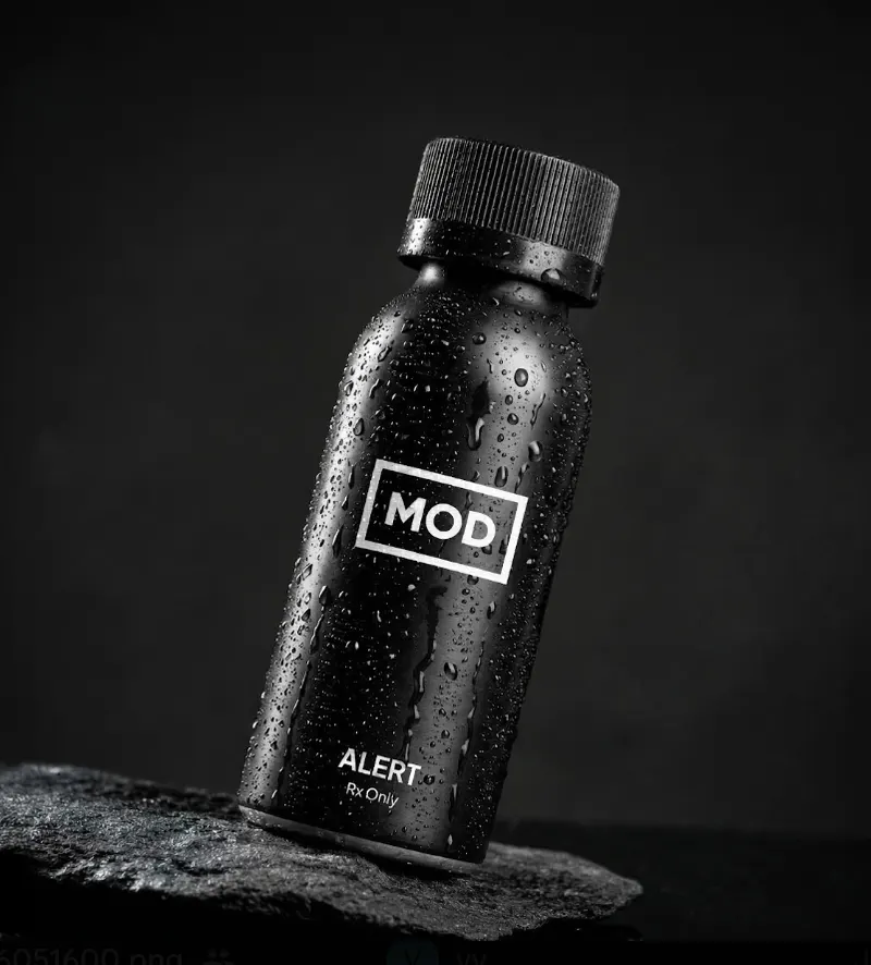 MOD alert bottle wet with black background tilted